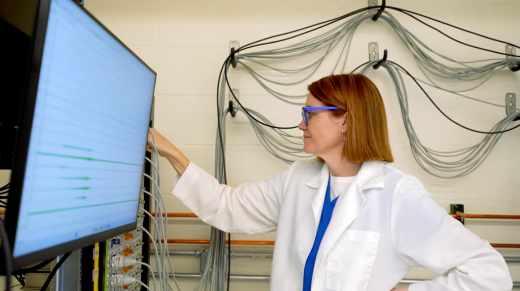 Theresa Pitts interacting with a large screen
