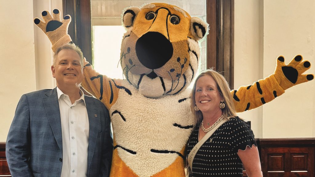 Chuck Beitel and Kara Chmielewski pose with Truman the Tiger